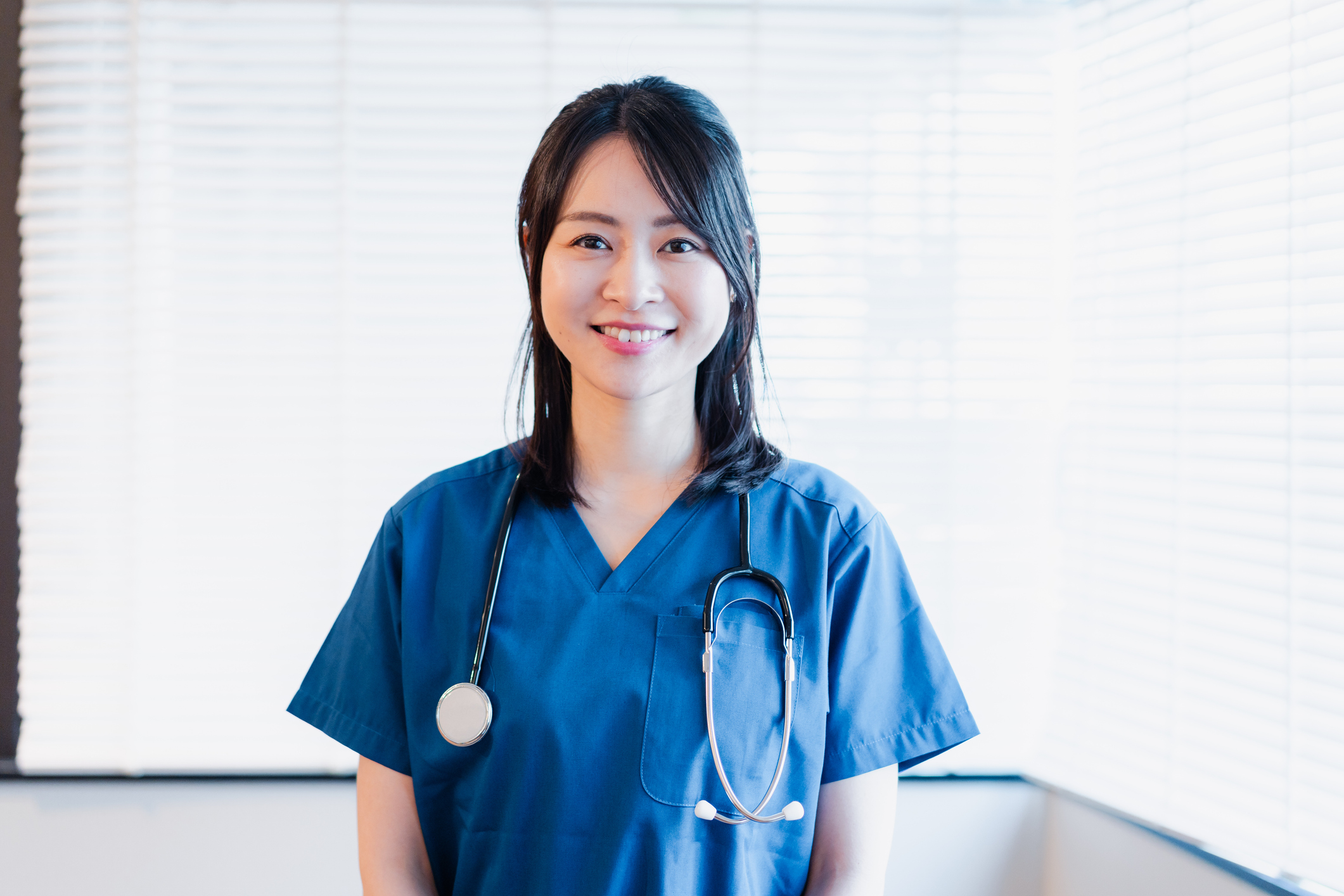 a female doctor smiling in her uniform